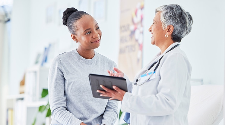 Woman and her doctor discussing what covered services she should get