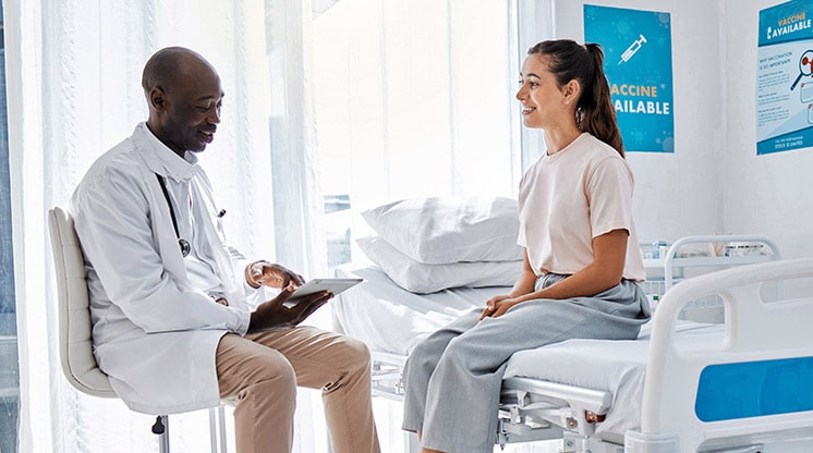 woman sitting and talking with doctor