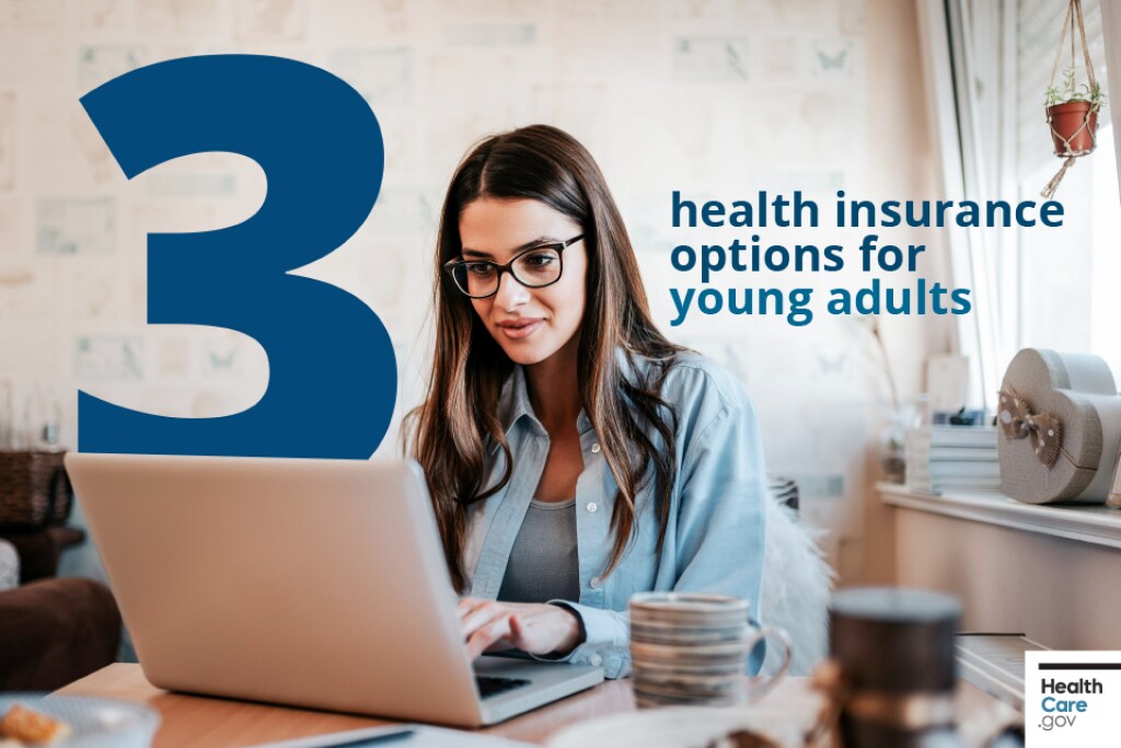 3 health insurance options for young adults Young woman in blue blouse and black glasses with her coffee cup nearby focuses on her computer as she explores her health insurance options online.