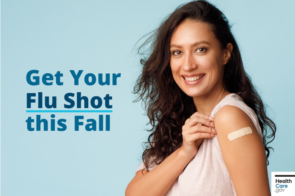 Get your flu shot this fall. Woman smiling with band aid on her arm. Text says, “Get your flu shot this fall.”