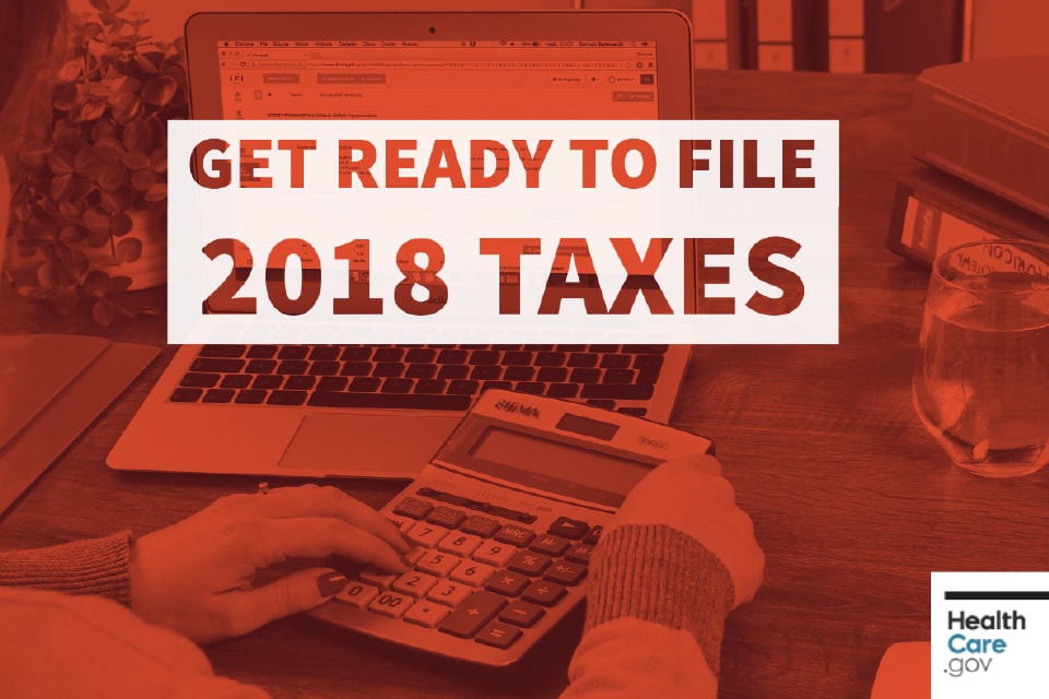 Image: {Woman sits at computer with calculator, prepares to file taxes}